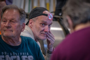 man with a no data centers button on his hat